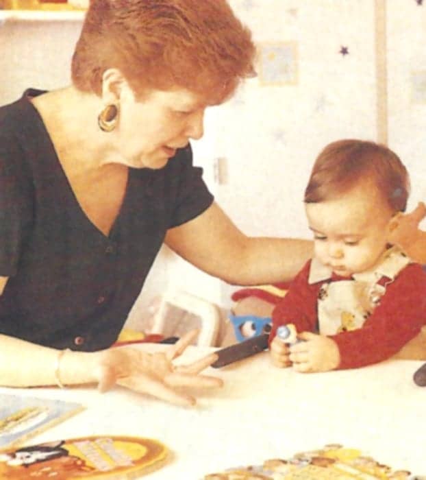 Mary Pat Moeller with baby in infant hearing