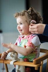 Child with hearing aid