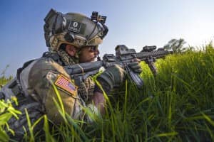 soldier aims gun