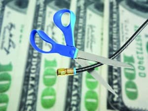 http://www.dreamstime.com/royalty-free-stock-image-cable-cut-over-money-scissors-cutting-coax-tv-concept-image54989186