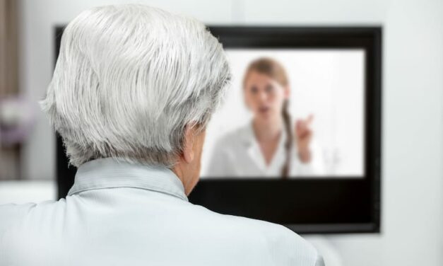 older man using telehealth to talk to doctor on screen
