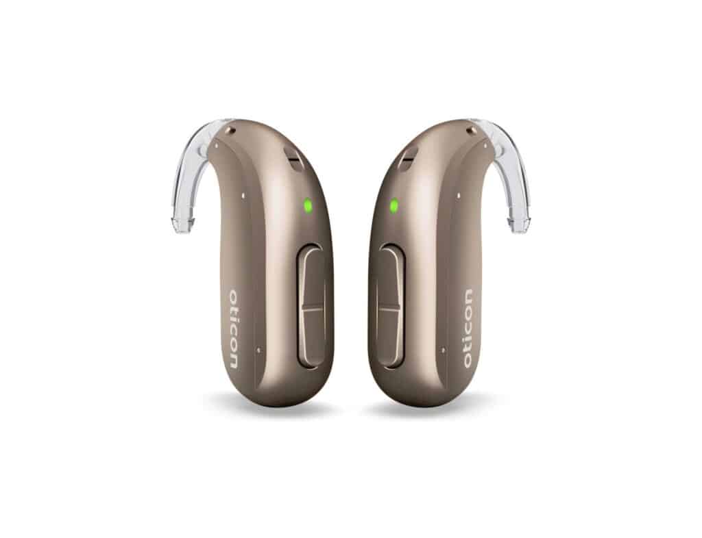 Pair of Oticon Intent miniBTE hearing aids in terracotta with hook.