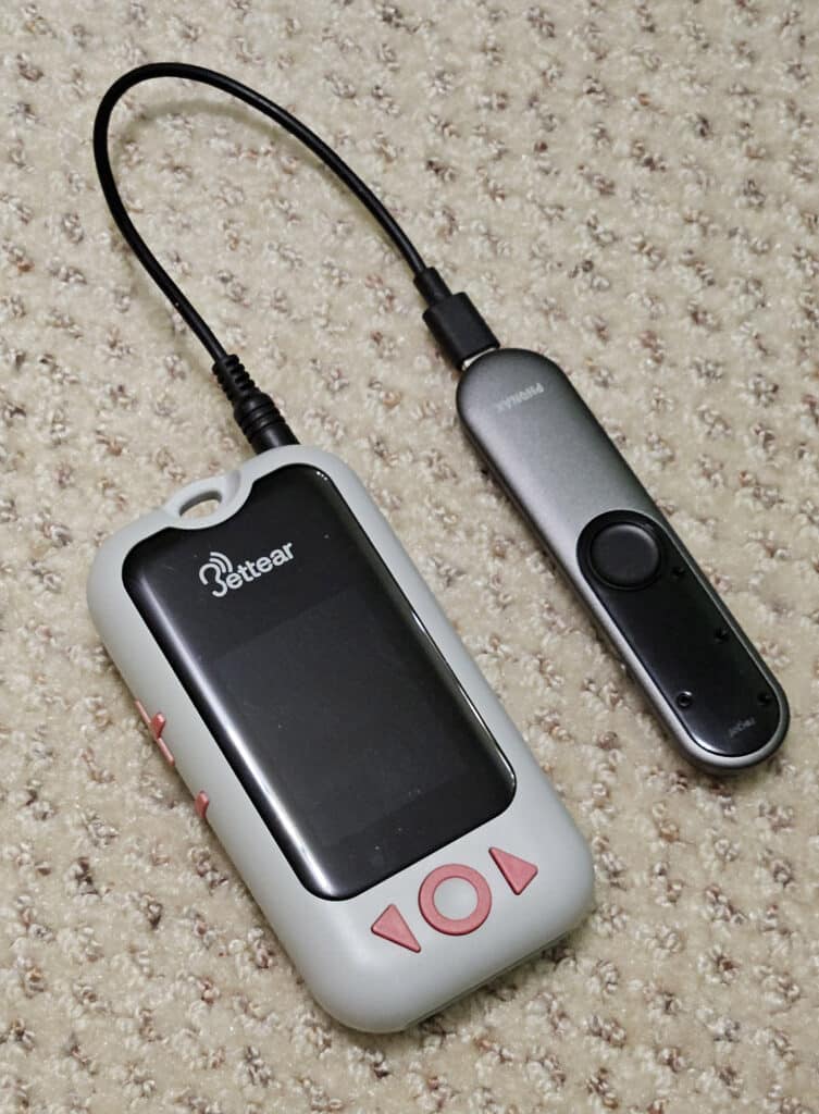 Figure 3. Assistive listening receiver plugged into remote mic for wireless streaming.