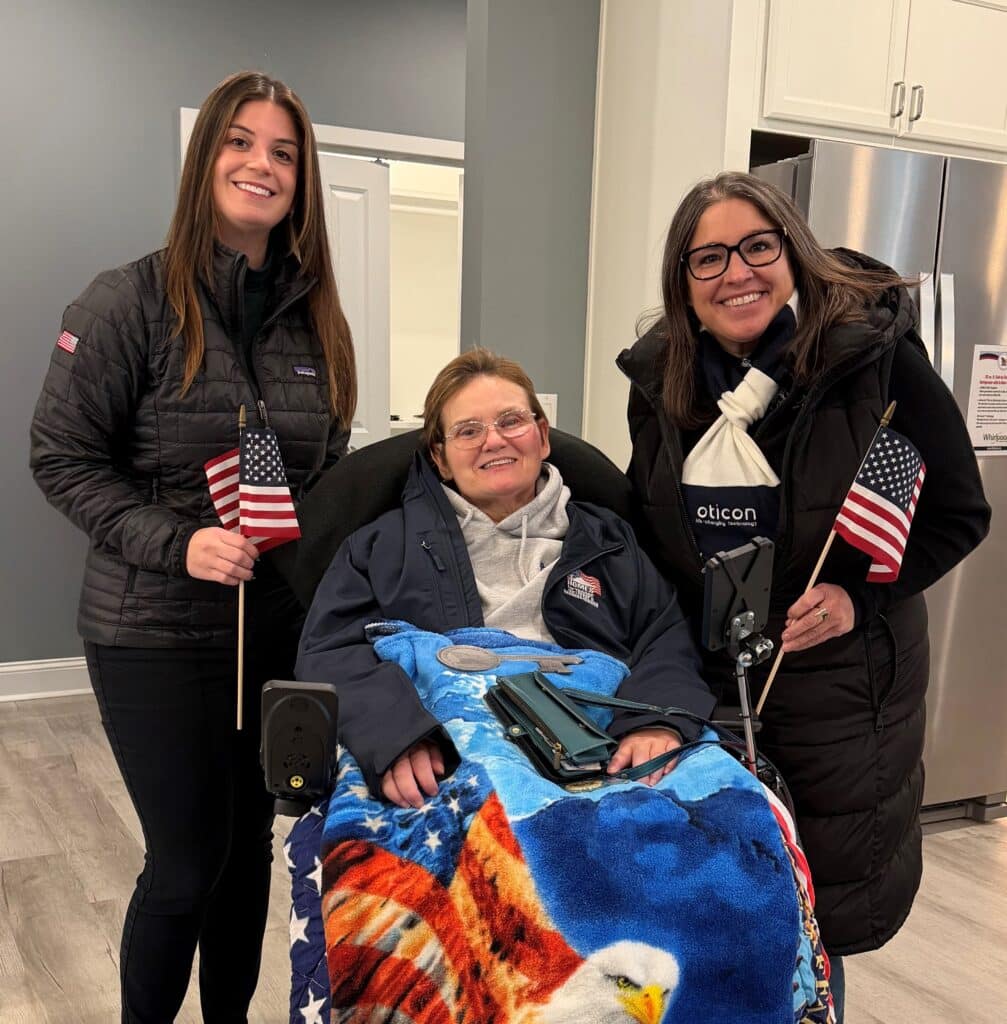 Oticon Government Services joined Homes For Our Troops (HFOT) in celebrating Army MAJ Dolly Harris as she received the keys to her specially adapted custom HFOT home.
