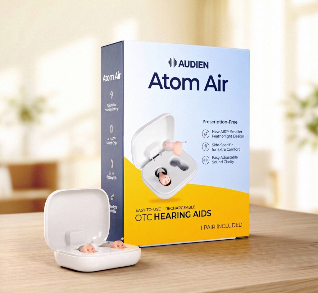 Audien Atom Air OTC hearing aids in charger on table next to packaging